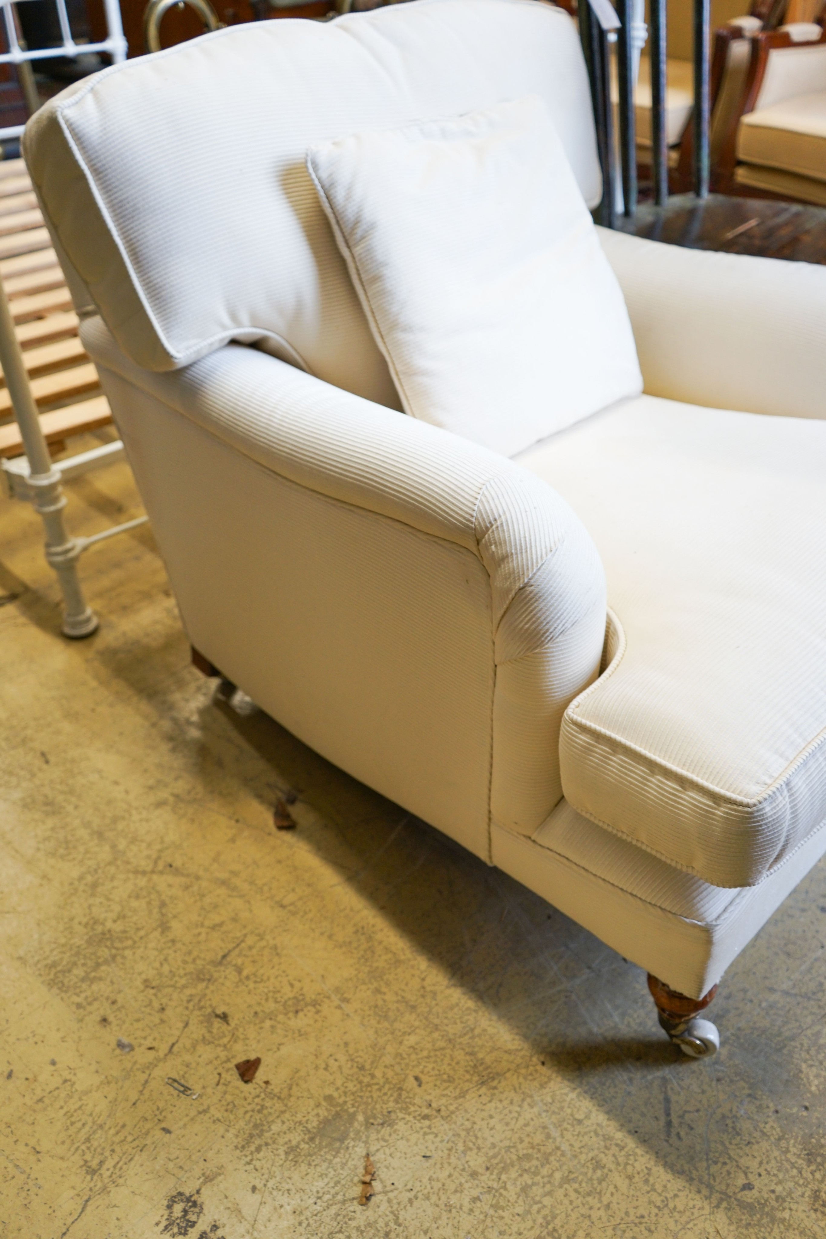 A Howard style upholstered armchair, width 84cm, depth 100cm, height 82cm